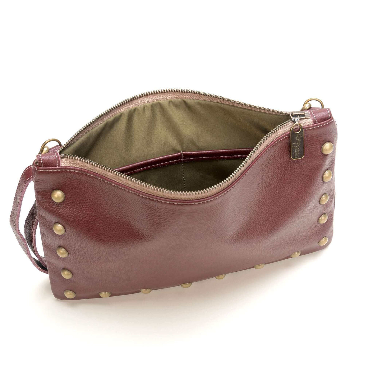 Interior of studded crossbody bag in plum full-grain leather small crossbody bag with detachable strap